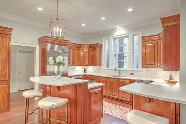 Finished kitchen remodel with cherry cabinets, center island and pendant lighting by Citadel Enterprises